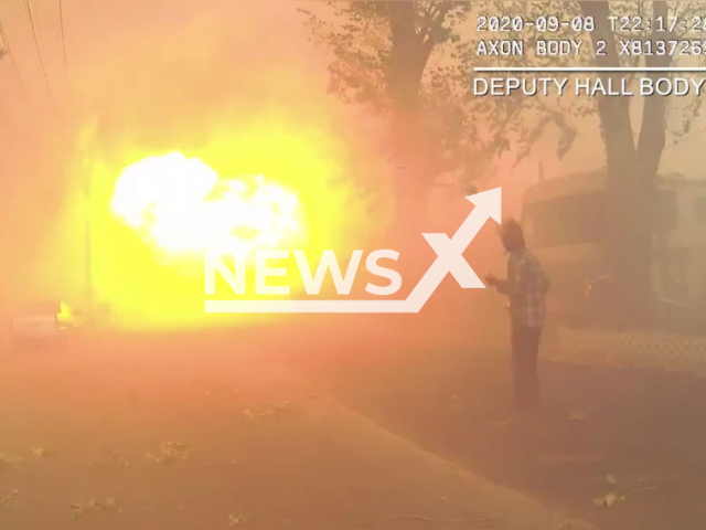 Officers rescue people from a fire in Jackson County, Oregon, USA on 8 September 2022. Note: Photo is a screenshot from the video (Jackson County Sheriff - Oregon/Newsflash)