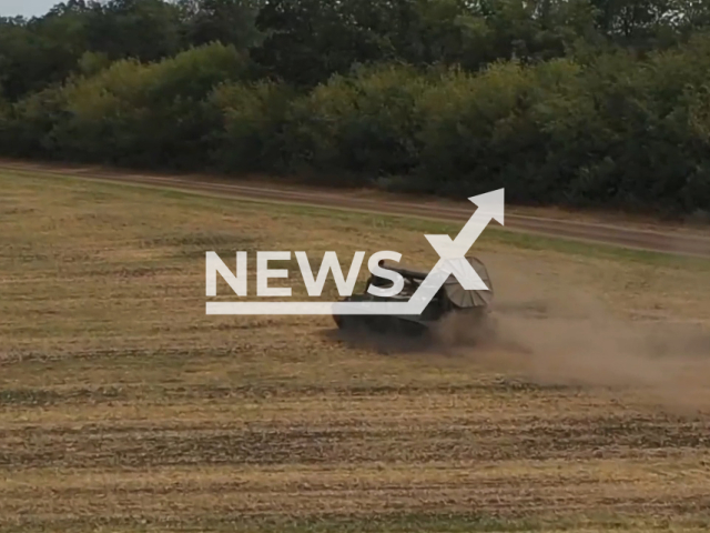 Russian 2S4 Tulip self-propelled heavy mortar rides across a field in Ukraine in undated photo. Crews of the 2S4 Tulip mortar of the Western Military District shot at Ukrainian camouflaged fortified positions and military equipment. Note: Picture is a screenshot from a video (@mil/Newsflash)