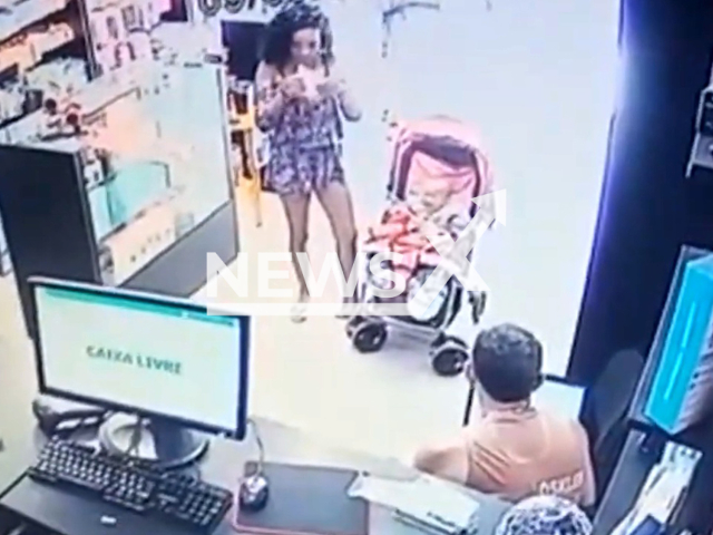 Picture shows Natalia Santos Sousa and the seven-month-old baby at  a cell phone store, in Novo Gama, Brazil, on Friday, Sept. 9, 2022. The woman kidnaped the baby for 3 days, she was detained and the baby was returned to its mother. Note: Picture is a screenshot from a video (Newsflash)