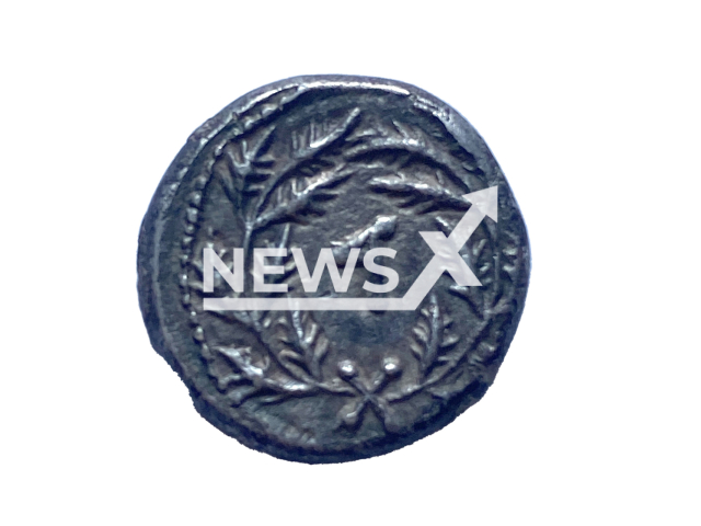 Photo shows a coin that has a floral wreath with the letter D in the centre, undated photo. It denotes the fourth year of the Jewish Great Revolt, in which the coin was minted. Note: Licensed photo (Israel Antiquities Authority/Newsflash)