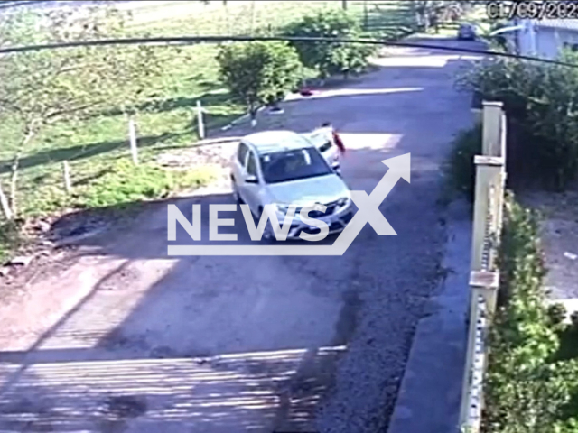 A child attempts to get in the car driven by his father, in Gaspar Brazil, on Wednesday, Sept. 7, 2022. The father Marcelo Schroeder,  left his 12-year-old son at home and did not notice until he arrived at the school. Note: Picture is a screenshot from a video (Newsflash)