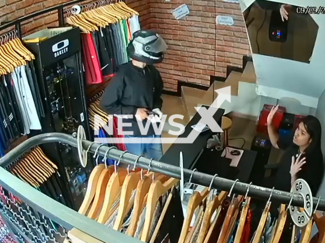 Armed thieves attempt to rob a in a clothing store in Sao Mateus, Brazil, on Friday, Sept. 9, 2022. Two of the theives  were shot by the owner and arrested.  Note: Picture is a screenshot from a video (Newsflash)