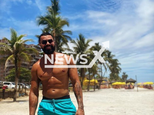 Personal trainer and CrossFit coach, Lucas Rodrigues Silva, 29, poses on a beach in an undated photo. Rodrigues was stabbed and murdered in Taguatinga, in the Federal District, Brazil on Sunday, Sept. 11, 2022. Note: Private photo (@lucasrs__/Newsflash)