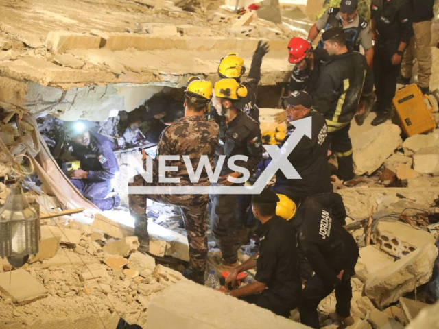 Photo shows the search efforts for the people who are trapped under the rubble in Amman, Jordan, in an undated photo. At least 25 people were in a dilapidated residential building in Amman when it crumbled on Tuesday, Sept. 13, 2022. Note: Photo is from the police (@Police_Jo/Newsflash)