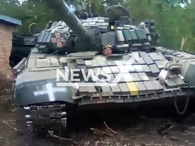 Ukrainian soldiers use a Russian tank that was left behind in the Kharkiv region, Ukraine. Kharkiv Oblast is a province of eastern Ukraine that borders Russia to the north.Note: Picture is a screenshot from a video (3 separate tank Iron Brigade/Newsflash)