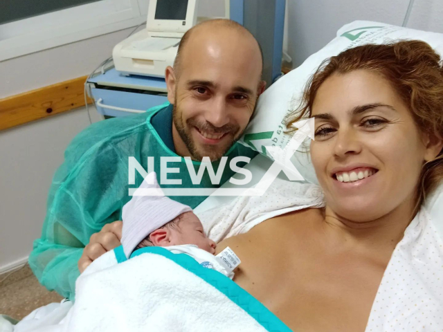 Beatriz Galan, 41, poses together with her husband and their baby in an undated photo. She gave birth in the bathroom of her house with her husband, following the instructions of a doctor by phone in Dos Hermanas, Spain, Tuesday, Sept. 6, 2022. Note: Picture is private (@vivalavitab/Newsflash)