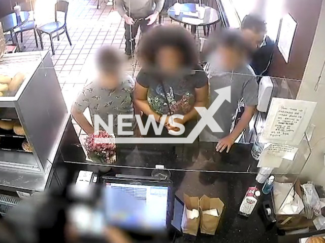 Man walks behind a boy and pinches him on the buttocks at Glendale donut shop in California, United States on Wednesday, Aug. 31, 2022. A male witness saw the incident and immediately stepped in to protect the boy. Note: This picture is a screenshot from the video (@GlendalePD/Newsflash).