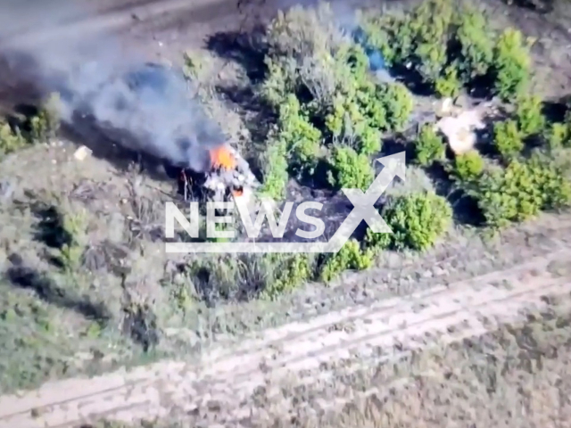 Damaged Russian tank burns in a field area in Ukraine, Wednesday, Sep. 14, 2022. Ukrainian Marine Corps destroyed 1 tank, 1 armored fighting vehicle, 2 infantry fighting vehicles, 2 Msta-B howitzers, 2 Gvozdika self-propelled artillery installations and KAMAZ vehicle with ammunition. Note: Picture is a screenshot from a video (@kmp.vmsu.ua/Newsflash)