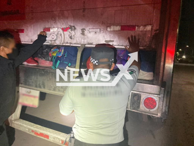 Officers of the Guardia Nacional rescue migrants on the Matehuala-Saltillo highway in Nuevo Leon, Mexico, on Wednesday, Sept. 14, 2022. Guardia Nacional and Instituto Nacional de Migracion rescued 121 migrants who were being transported in a tractor-trailer in overcrowded conditions. Note: Photo from Guardia Nacional (@GN_MEXICO_/Newsflash)