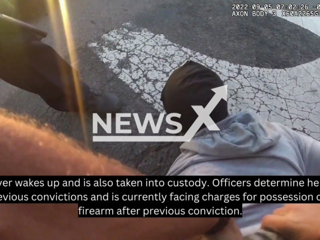 Police officers arrest armed suspects passed out in a vehicle in Oklahoma City, Oklahoma, USA. Note: Picture is a screenshot from a video (Oklahoma City Police Department/Newsflash)