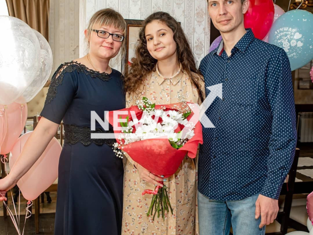 Lyudmila Grigorenko, 37, poses with her ex-husband Igor Gaidey and an unidentified girl, in an undated photo. She was allegedly killed by her ex-husband, Igor Gaidey in Ivdel, Russia. Note: Picture is private (Lyudmila Grigorenko/Newsflash)