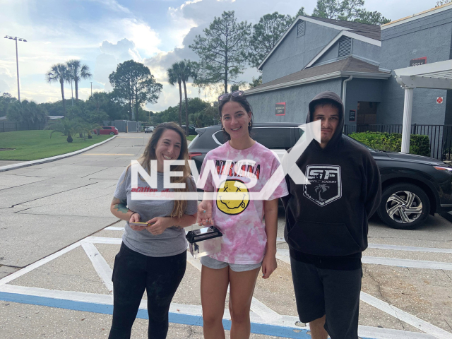 Kira Rumfola (middle) poses together with Ismael, a customer service agent at Southwest Airlines at Tampa International Airport in Florida, U. S., and Jamee, Ismael's fiancee, another Southwest employee, in an undated photo. Ismael took care of Kira's beloved fish, Theo, after she learned she couldn’t take it on her flight when leaving for the summer. Note: Picture is private (Kira Rumfola/Newsflash)