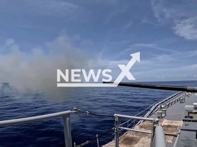 HMAS Perth fires her 5" gun during an anti-aircraft firing serial in the Northern Australian Exercise. Note: This picture is a screenshot from the video (Royal Australian Navy/Newsflash).