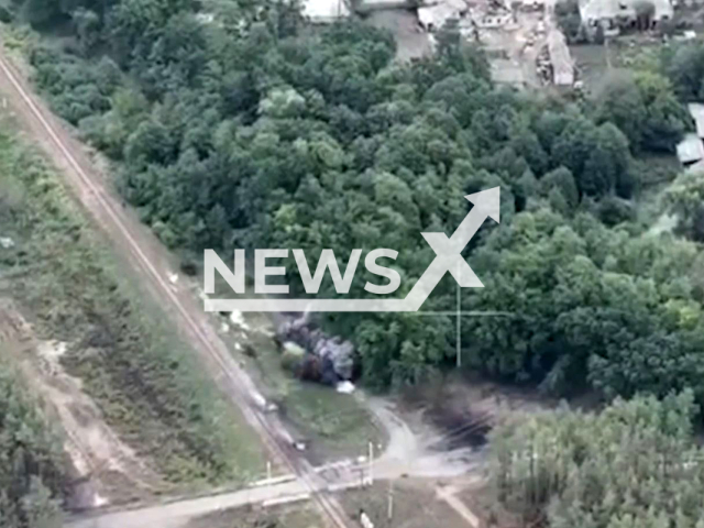 Picture shows an explosions near trees in a residential area in Ukraine in undated photo. Fighters of the 44th separate artillery brigade named after Hetman Danylo Apostol shoot Russian positions with military personnel and equipment. Note: This picture is a screenshot from the video (@44art.br/Newsflash).