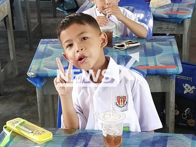 Muhammad Arif Fayyadh bin Wahyu Asmi, 7, poses in an undated photo. He tragically died after a shard from the glass coffee table he fell on punctured his chest in Banting, Malaysia, Friday, Sept. 16, 2022. Note: Picture is private (Newsflash)