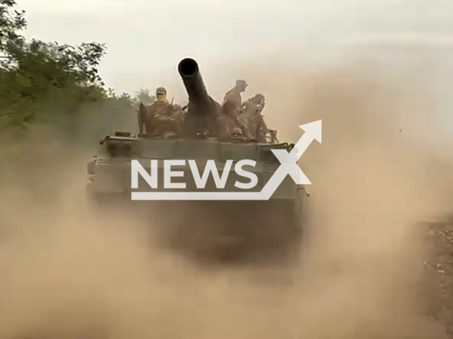 Soldiers of the 43rd Separate Artillery Brigade named after Hetman Taras Tryasyl driving on a tank in Ukraine in undated footage.
The 43rd Separate Artillery Brigade sarcastically stated that they are going to deliver the ballots for referendums announced by Putin. 
Note: This picture is a screenshot from the video.
(@43oabr/Newsflash)