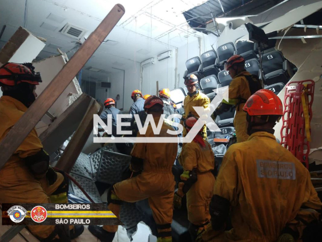 The fire fighters  work at the container company after part of  the building collapsed in Itapecerica da Serra, Brazil, on Tuesday, Sept. 20, 2022. It left 9 people dead and 31 injured. Note: Picture from fire fighters  (@BombeirosPMESP/Newsflash)