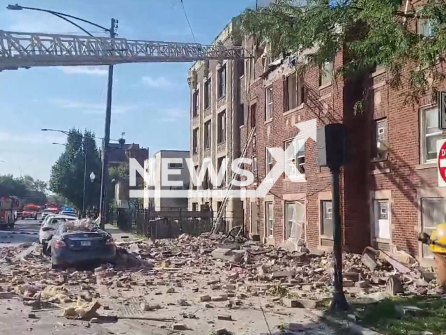 Firefighters evacuate the building after the explosion in Chicago, USA on Sept.20, 2022. 8 people were seriously injured in this incident. Note: This picture is a screenshot from the video (@CFDMedia/Newsflash).