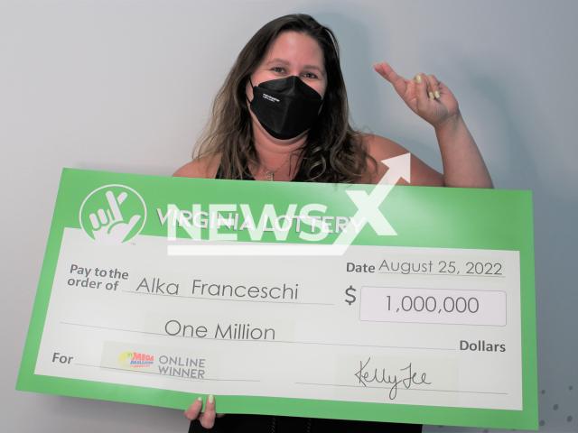 Alka Franceschi poses with her  USD 1 million Mega Millions prize  check, in Virginia Beach, Virginia, USA,  undated. She let the numbers  be randomly chosen by the computer, and  after receiving  an email saying she won, did not know the amount until two weeks later when she logged into her account. Note: Licensed photo.  (Virginia Lottery/Newsflash)