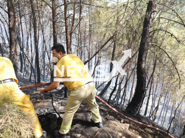 Photo shows a scene from the efforts to put out the wildfire that hit Turkey's resort town of Marmaris in Mugla, Turkey, Wednesday, Sept. 21, 2022, undated photo. The fire broke out in the Yalancibogaz area of Marmaris, located in the southwestern province of Mugla. Note: Photo is from the Marmaris Municipality (@marmarisbeltr/Newsflash)