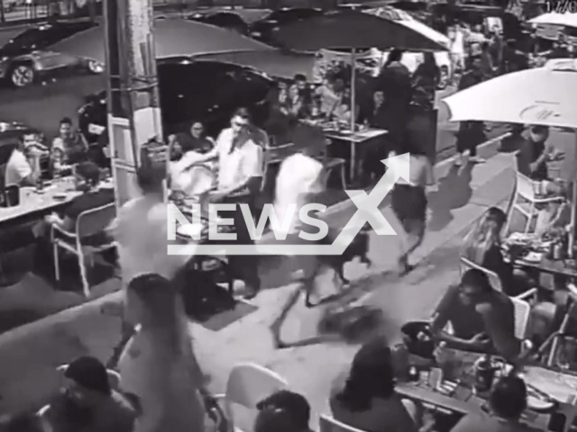 People run on a sidewalk in Boa Viagem, Recife in Brazil, Saturday, Sept. 17, 2022. The bar guests then panic and start to run as well. Note: Picture is a screenshot from a video (Newsflash)