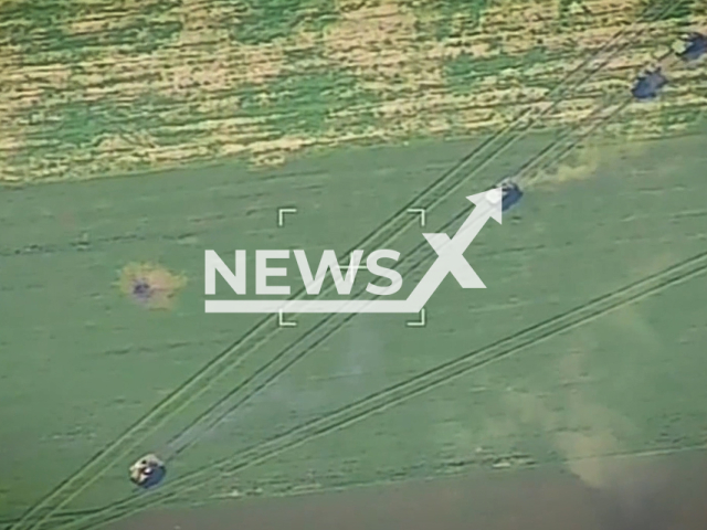 Picture shows Ukrainian armored fighting vehicles on an open field before being destroyed by the Russian Airborne Forces in Ukraine in undated footage. Ministry of Defense of Russia claim that in the battle the Russian Airborne Forces destroyed more than 120 Ukrainian servicemen, armored vehicles and lightly armored vehicles. Note: This picture is a screenshot from the video. (Ministry of Defense of Russia/Newsflash)