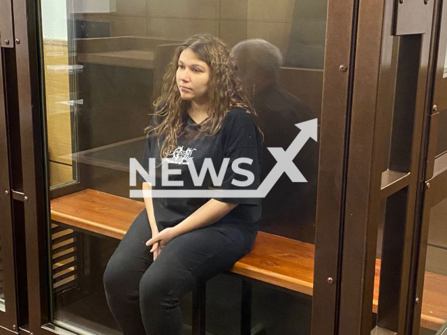 Unnamed 24-year-old woman sits on a bench inside of court room in Moscow, Russia, Wednesday, Sep. 21, 2022. Court arrested the woman accused of killing her newborn female child. Note: This picture is obtained from the Prosecutor's Office of Moscow (@moscowproc/Newsflash).