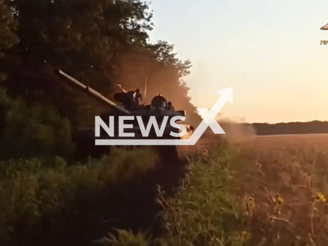 DPR T-90 tank goes down the road in a field area near Maryinka, Donetsk region, Ukraine in undated photo. Tankers of the 291st motorized rifle regiment of the Southern Military District of the People's Militia of the DPR shot at Ukrainian fortified areas from T-90 tanks. Note: Picture is a screenshot from a video (@nm_dnr/Newsflash)