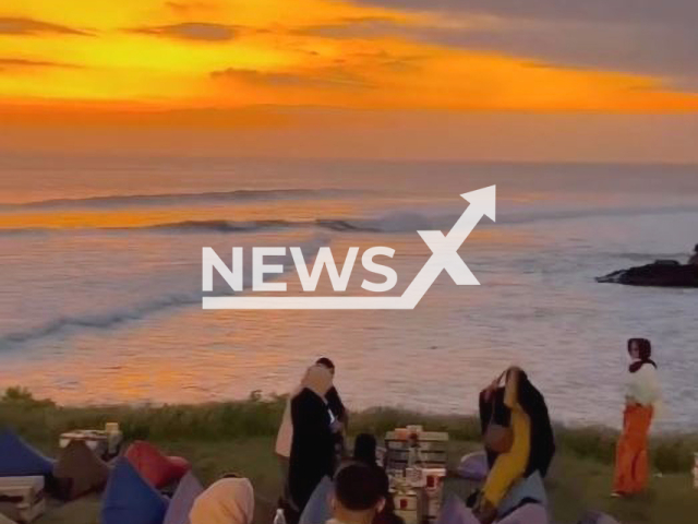 Sunset at The Beach Love (Pantai Cinta Kedunggu) in Bali, Indonesia on July 27, 2022. Note: This picture is a screenshot from the video (@nayyaafo/Newsflash).