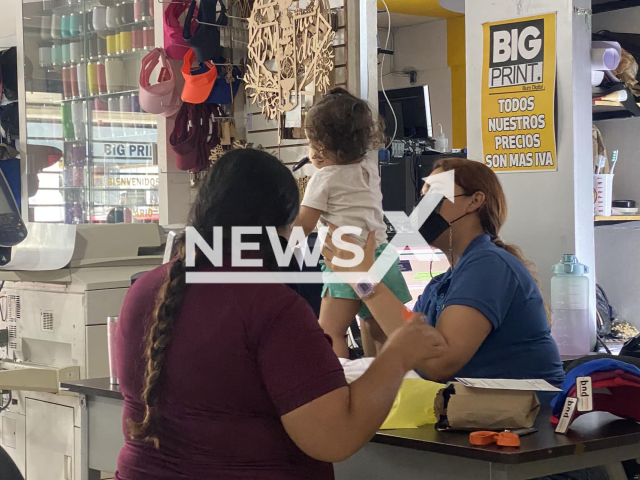 Picture shows employee Rosita with her  daughter Vianey and an unidentified woman, at the store, undated, in Guasave, Mexico. Luis Ricardo Ruiz  allowed one of his workers Rosita  to take her  daughter to her workplace to prevent her from resigning because she did not have someone to help her take care of her daughter.  
Note: Private photo.  (@ricardobigprint/Newsflash)