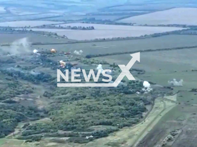 Picture shows explosions in a field area in Donetsk region, Ukraine in undated photo. Defenders from the 25th Separate Sicheslav Airborne Brigade shot at Russian positions. Note: Photo is a screenshot from a video. (@dshv25opdbr/Newsflash)