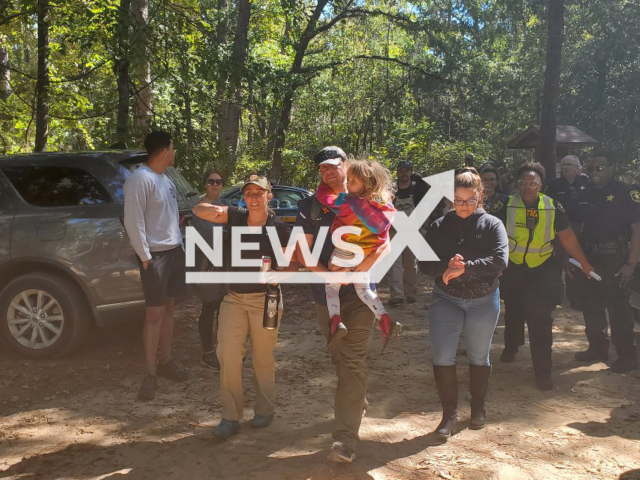 Police officers escort Ruby Heider, in Sumter County, South Carolina, on Saturday, Sept. 24, 2022. Ruby Heider was missing for nearly 20 hours before being reunited with her family. Note: Photo from police (Sumter County Sheriff's Office (Sumter, SC)/Newsflash)