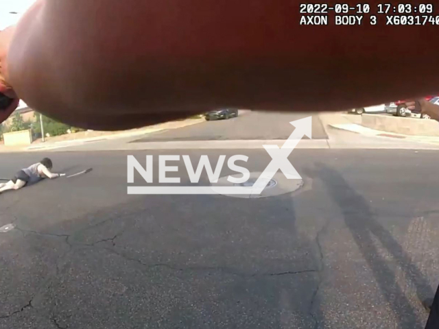 Phoenix Police officer shoots a sword-wielding suspect in Phoenix, Arizona, Saturday, Sept. 10, 2022. The man, identified as Aaron Baughman, 40, died at hospital. Note: Photo is a screenshot from a video. (PhoenixPolice/Newsflash)