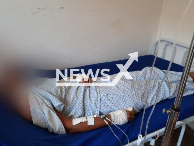 The victim lies in a hospital bed in an undated photo. The victim's husband, a 37-year-old man, woke up in the middle of the night after dreaming that she was cheating on him and stabbed her in Planaltina, in Goias, Brazil, on Tuesday, Aug. 9, 2022. Note: Photo from police (PCGO/Newsflash)