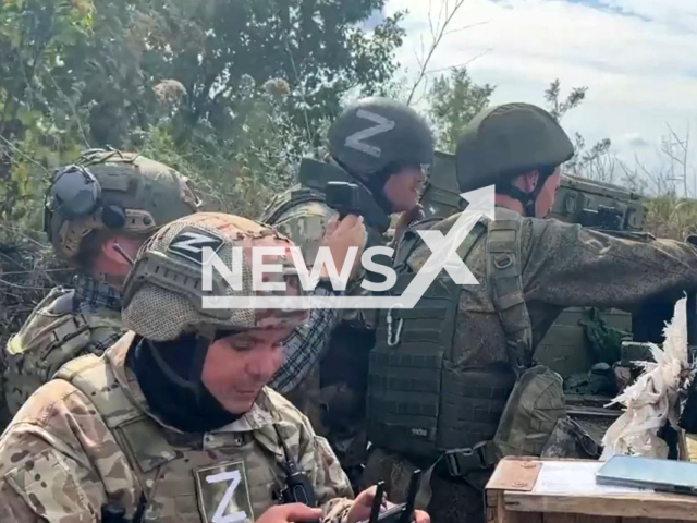 DPR soldiers work with remote screen of unmanned aerial vehicle in their dugout in Pervomaiskoye village, Donetsk region, Ukraine in undated photo. Soldiers of the 11th regiment of the People's Militia of the DPR attacked Ukrainian tank with help of UAV (unmanned aerial vehicle). Note: Photo is a screenshot from a video.(@nm_dnr/Newsflash)