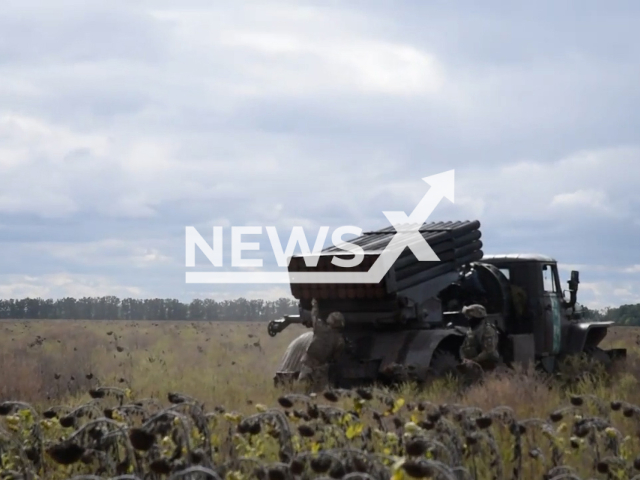 Two Ukrainian soldiers prepare BM-21 Grad multiple rocket launcher system for work in the the south of Ukraine in undated photo. Soldiers of the Airborne Assault Troops of the Armed Forces of Ukraine shot at Russian invaders with help of BM-21 Grad multiple rocket launcher systems. Note: This picture is a screenshot from the video . (@www.dshv.mil.gov.ua/Newsflash)