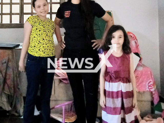 Isadora Alves de Faria, 30,  and her daughters Maria Alice, 10, and Lavinia, 6, pose in undated photo.
 The children were found killed in Edeia, Brazil, on Tuesday , Sept. 27, 2022.
 Note: Private photo.  (Newsflash)