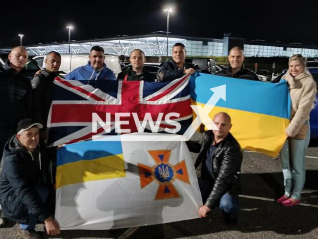 Ukrainian and British rescuers hold their national flags in Birmingham, Great Britain in undated photo. Ukrainian firefighters will take part for the first time in the international Rescue Festival challenge. Note: this picture is obtained from the United Kingdom Rescue Organisation. (@ukroorg/Newsflash)