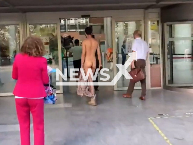 Alejandro Colomar, 29, walks naked in front of the court in Valencia, Spain, in undated footage. Colomar has already received nearly a dozen fines of about 3,000 euros. Note: Picture is a screenshot from a video. (Newsflash)