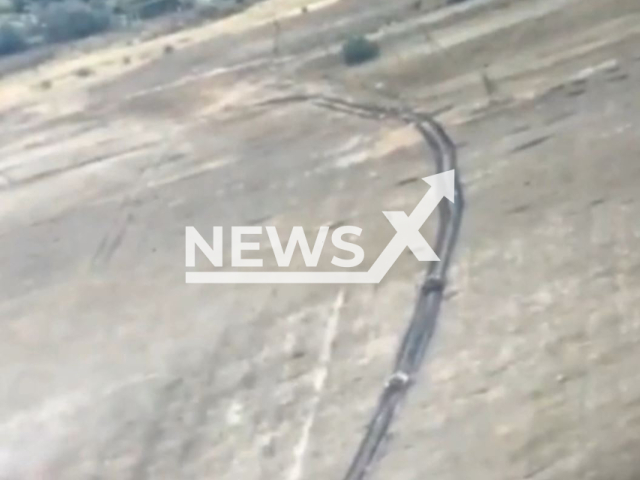 Column of Russian tanks goes down the road in a field area of Donetsk region in undated photo. Fighters of the National Guard of Ukraine destroyed Russian enemy tank. Note: This picture is a screenshot from the video . (@NGUmainpage/Newsflash)