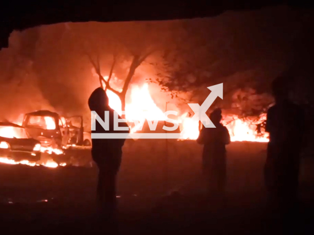 Picture shows people stand Infront of the burning parking lot vehicles after the Russian attacks on the Mykolaiv region in Ukraine on Friday, September 30, 2022.
According the Ukrainian authorities the Russian military used Iranian drones and Iskander rockets for the attacks on the civilian targets.
Note: This picture is a screenshot from the video.
(@VitaliiKimODA/Newsflash)