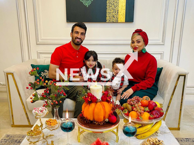 Hossein Mahini poses with his family in an undated photo. Mahini, a former player in the Iranian Persepolis soccer club, was arrested on Thursday, Sept. 29, 2022, after a court order was issued against him due to his social media posts supporting the protests. Note: Picture is private (@hossein_mahini_13/Newsflash)