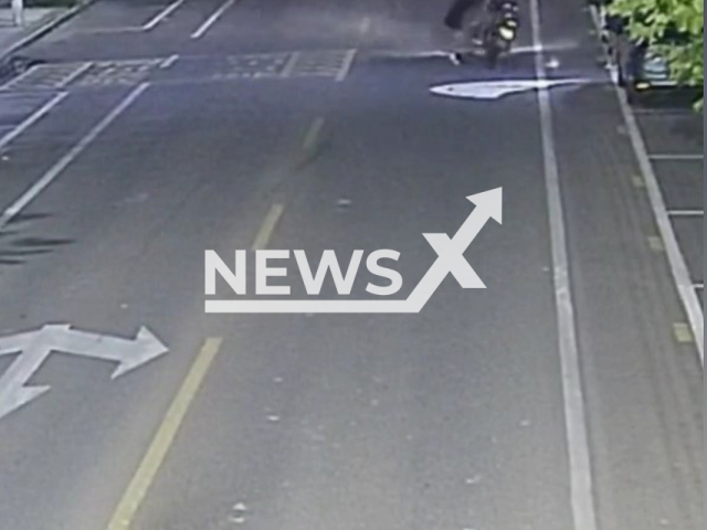 Drunk driving man hits teen posing for a photo on the road in the middle of the night in Huichang, Jiangxi Province. China, undated. The 14-year-old girl suffered abrasions while the driver had a head injury when he hit her. Note: Photo is a screenshot from the video (Huichang Traffic Police/AsiaWire)