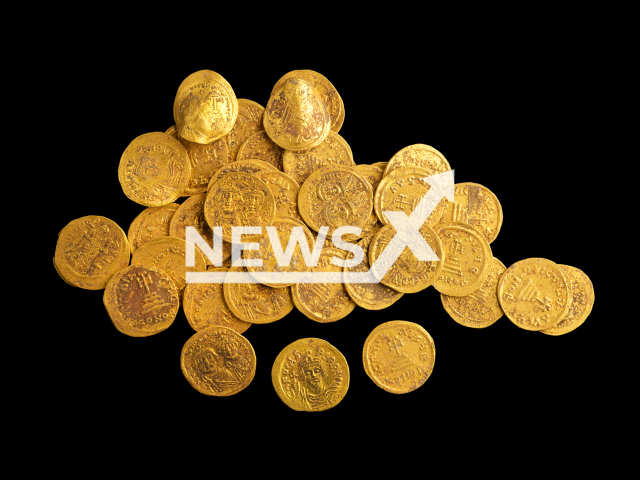 Picture shows the 44 pure gold coins, undated. The coins  minted between 602 and  641 AD  was discovered during an archaeological excavation by the Antiquities Authority at the Banius site within the Hermon River Nature Reserve, Israel.  Note: Licensed photo.  (Dafna Gazit, Antiquities Authority/Newsflash)