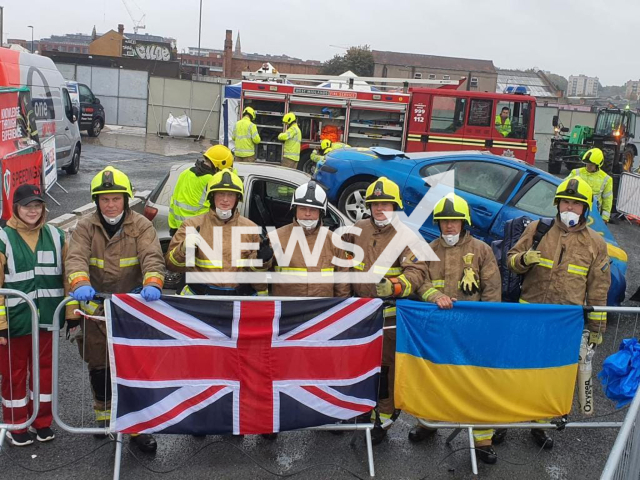 Ukrainian participants pose with British and Ukrainian flags at international Festival of Rescue in Birmingham, UK in undated footage. The experience of international trainings will be implemented by Ukrainian rescuers in eliminating emergency situations in Ukraine. Note: This photo is obtained from the State Service of Ukraine for Emergency Situations. (@MNS.GOV.UA/Newsflash)