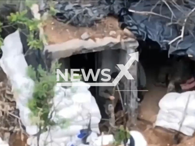 Ukrainian soldier comes out from dugout in Donetsk region, Ukraine in undated photo. Soldiers of the 3rd brigade of the People's Militia of the DPR discovered and shot at the stronghold of Ukrainian militants with the help of ATGMs (anti-tank guided missile). Note: Picture is a screenshot from a video (@nm_dnr/Newsflash)