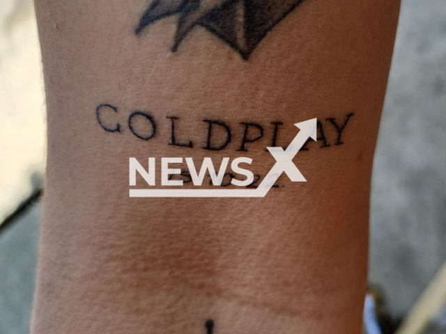 The tattoo Coldplay 10.15.2022, on the  arm of Vanderley Vieira, 26, undated. He had the  date of a Coldplay concert in Sao Paulo, Brazil, tattooed, before it was postponed. 
Note: Private photo.  (@v_vieiraz/Newsflash)