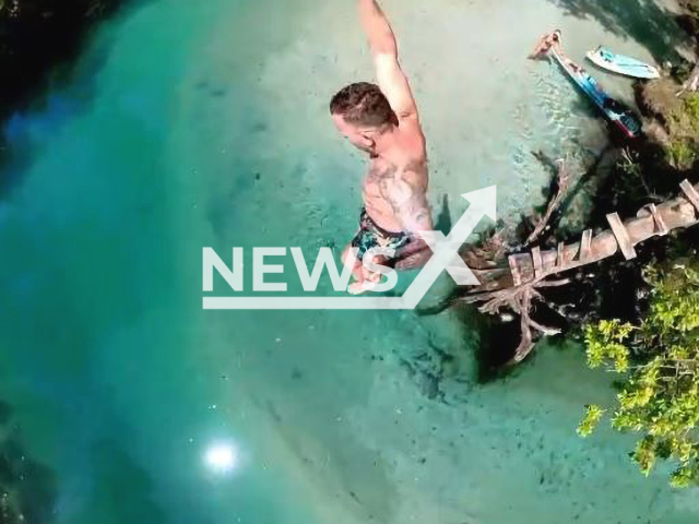 A man jumped from a high tree in Hernando County Florida, USA in May 2022. Note: Photo is a screenshot from a video.(@aquahollic/Newsflash)