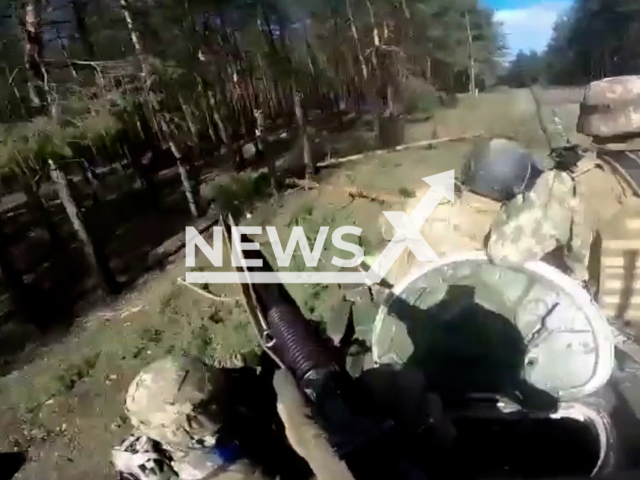 Picture shows Ukrainian soldiers on an armored fighting in forest in Ukraine in undated footage.
Ukrainian forces are pushing to consolidate their recent advantage over the Kremlin's forces and are said to be making significant gains towards liberating territory in the east and the south of the country. Note: This picture is a screenshot from the video. (@AFUStratCom/Newsflash)