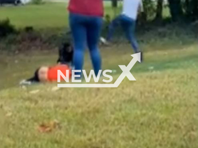 Good samaritan approaches the suspect after a shooting in Montgomery County, Maryland, USA on Saturday, Oct. 1, 2022. The suspect, Marcus Elijah Conway, 24, has been arrested and charged after the shooting. Note: Photo is a screenshot from a video.(Montgomery County Police Department/Newsflash)